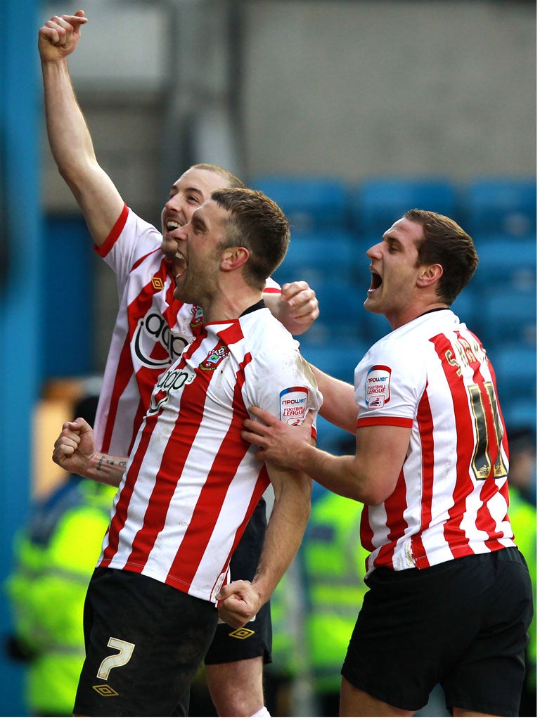 Saints alive: Rickie Lambert celebrates after his fourth hat-trick of the season