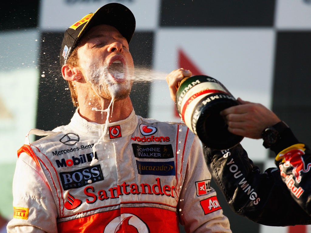 Button celebrates his victory in Melbourne