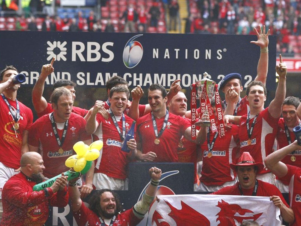 Captain Sam Warburton holds the Six Nations trophy during Wales’ Grand Slam celebrations