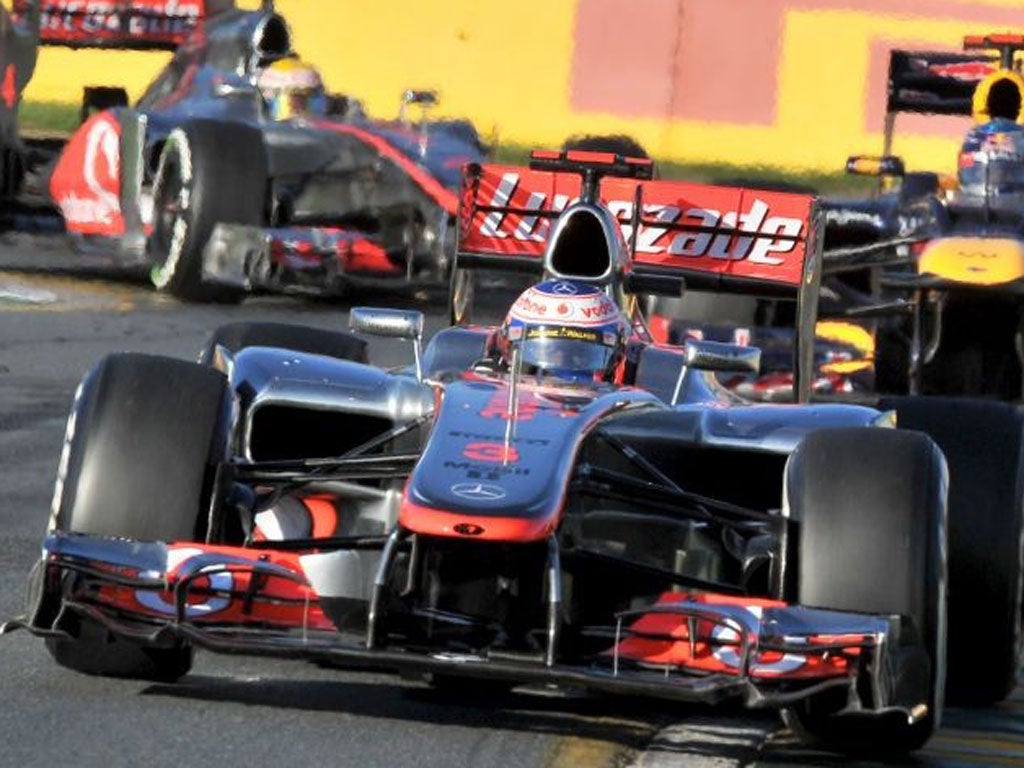 Jenson Button leads Sebastian Vettel and British team-mate Lewis Hamilton on his way to a stunning victory in the season-opening Australian Grand Prix yesterday