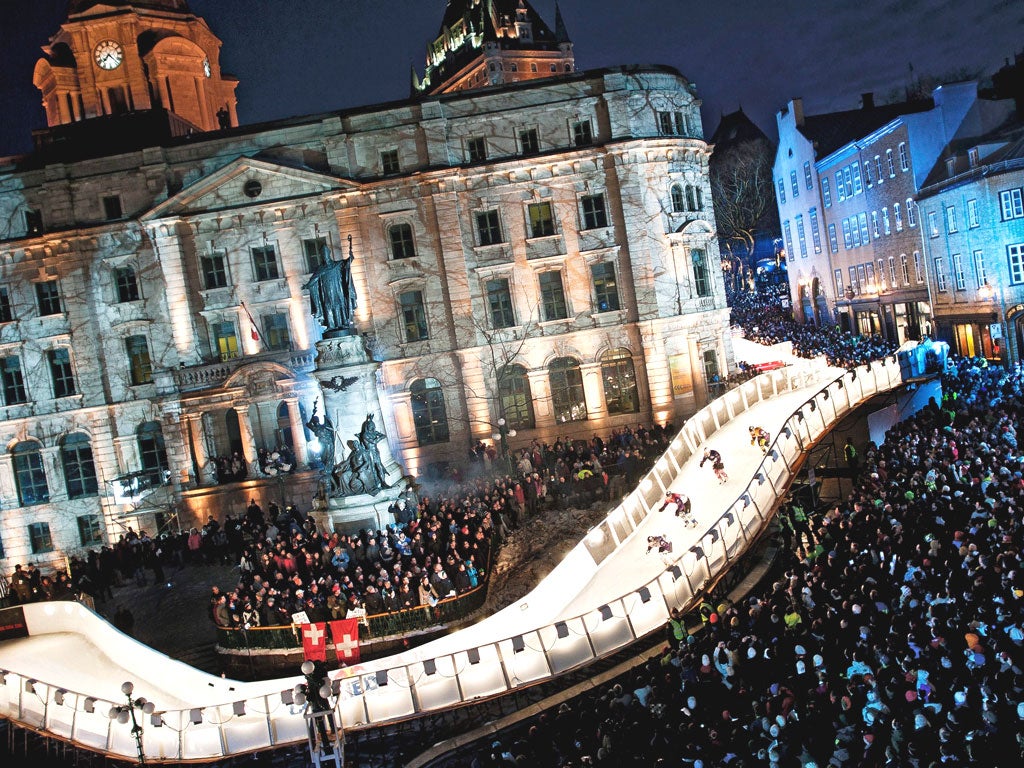 Competitors skating during the final stage of the Red Bull Crashed Ice World Championship in Quebec, Canada