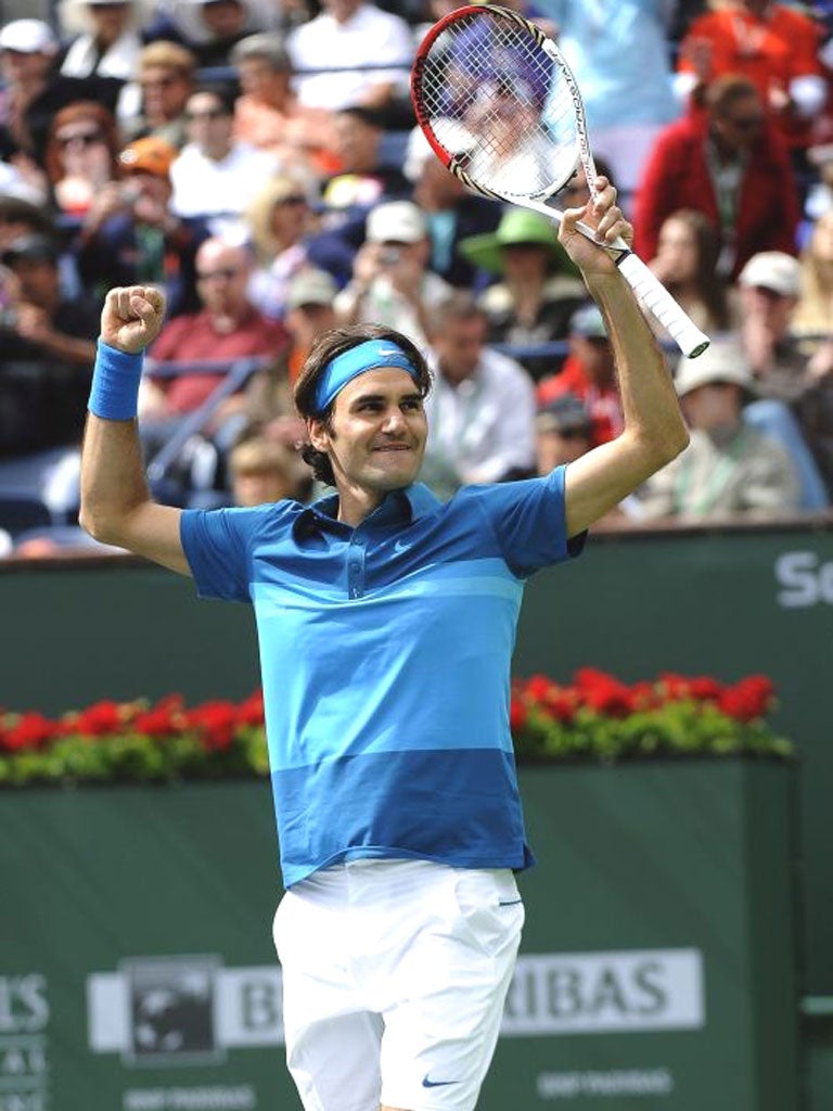 Roger Federer celebrates winning the Indian Wells Masters yesterday