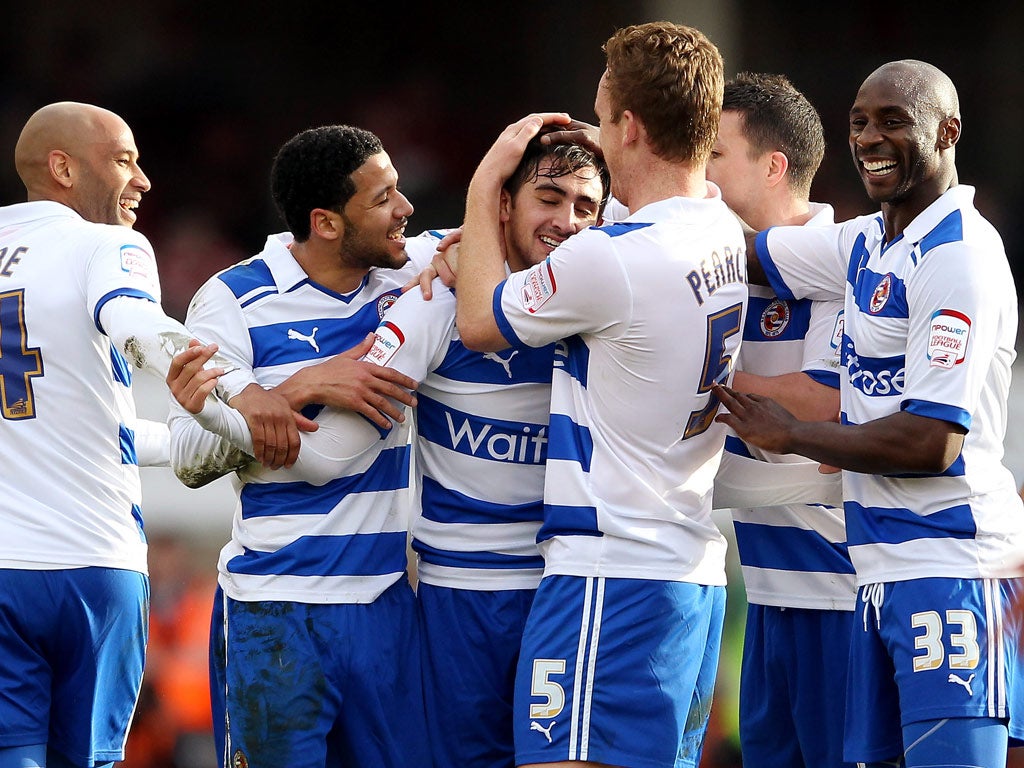 Jem Karacan is congratulated by his Reading team-mates