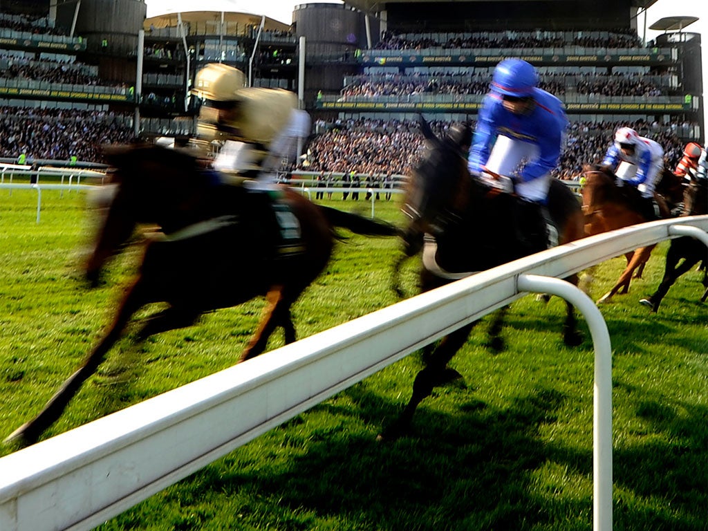 Paul Gallagher guides Prince De Beauchene (left) to glory in the John Smith's Handicap at Aintree last April