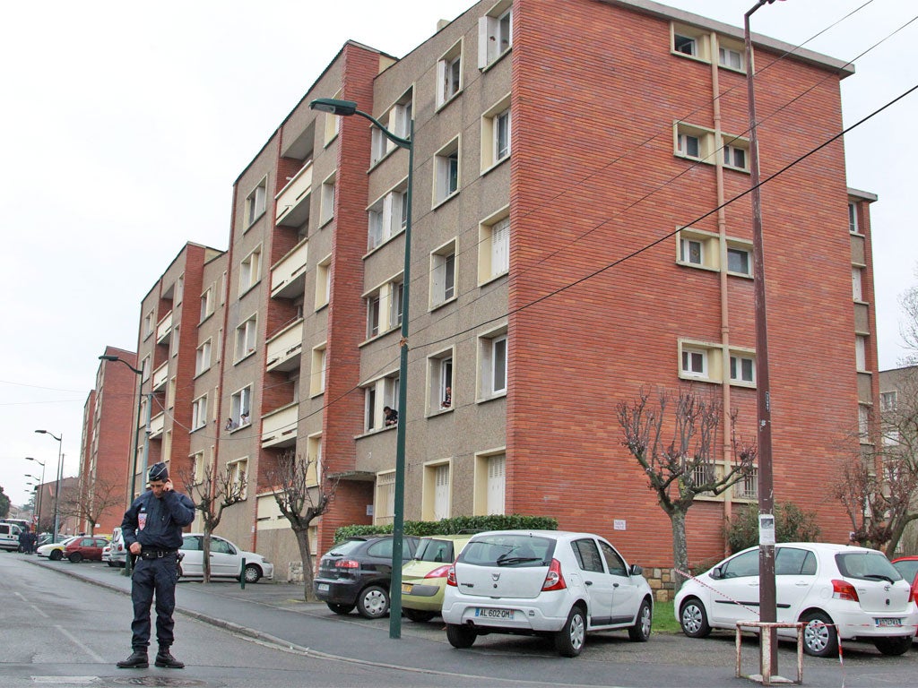 A police officer near the flats where Mohamed Merah was trapped