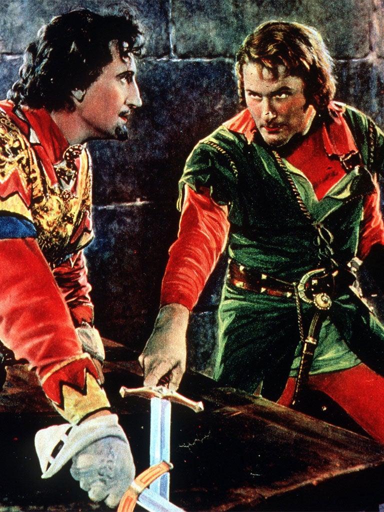 Errol Flynn as the dashing Robin Hood, right, battles it out with Basil Rathbone, the Sheriff of Nottingham, in the 1938 movie 'The Adventures of Robin Hood'