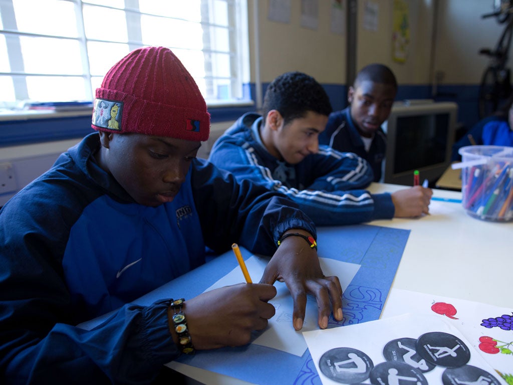 Joao Pateco Te, Hasan Ibrahim, and Tayo Ogbaro in class