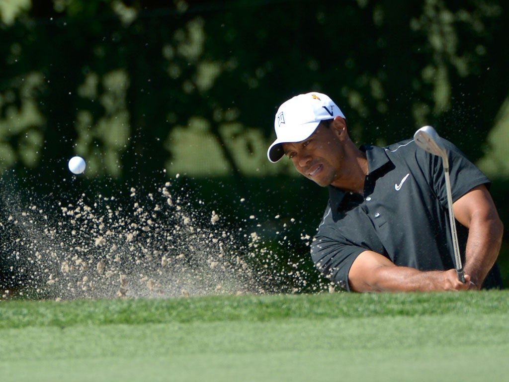 Tiger Woods chips out of a bunker during his return to form at the Bay Hill Invitational