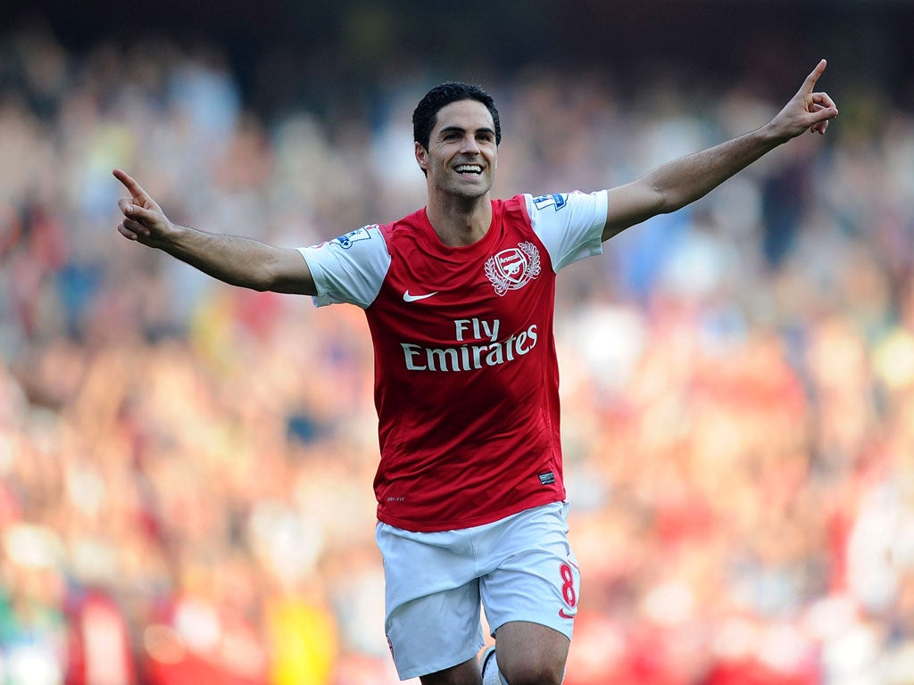 Mikel Arteta celebrates scoring Arsenal's third goal