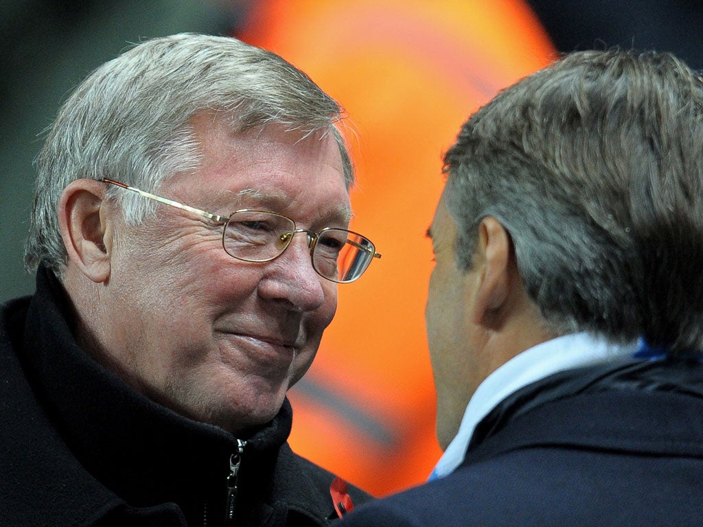 Behind the smile: Sir Alex Ferguson's mouth can act as a 12th man for United, but City's Roberto Mancini knows the score