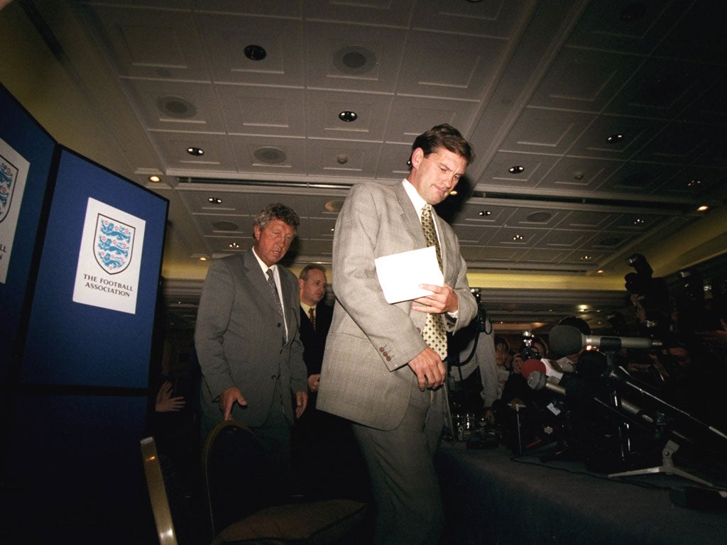 Glenn Hoddle arrives at a press conference after being sacked as England coach in February 1999 for his controversial beliefs on reincarnation