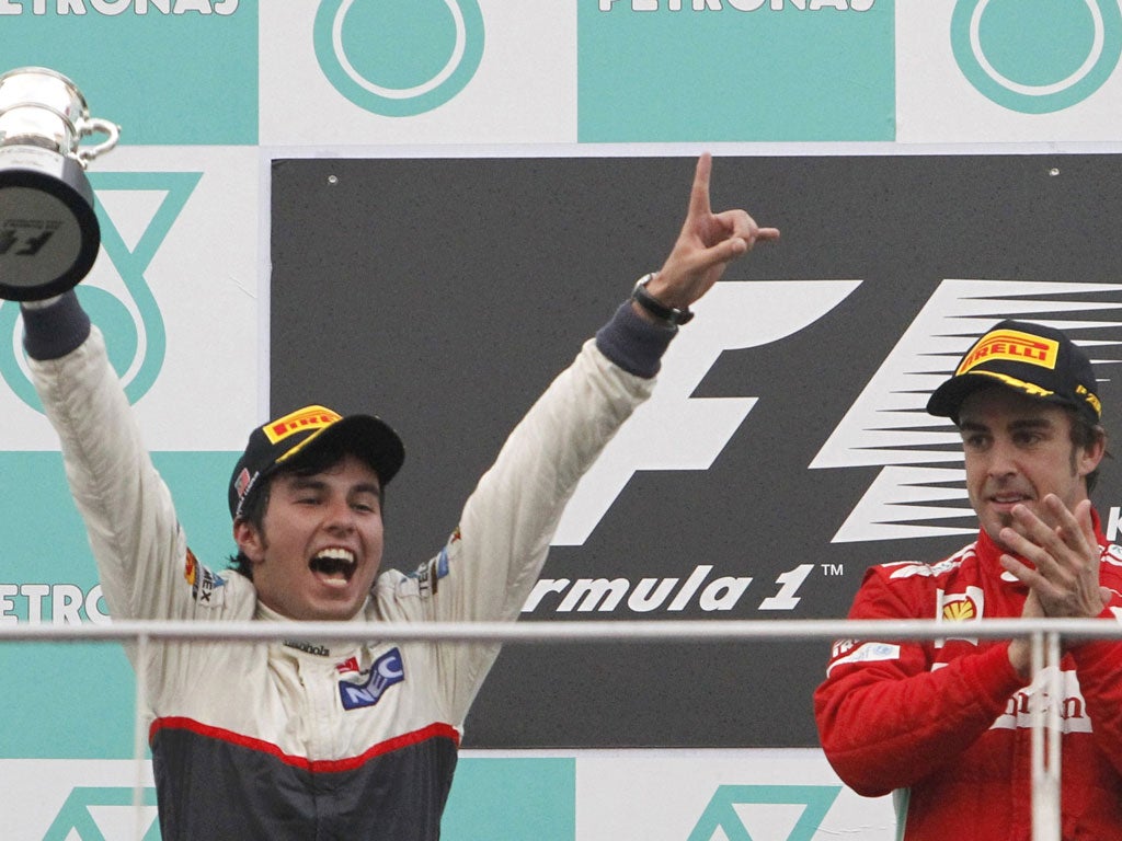Sergio Perez with race winner Fernando Alonso