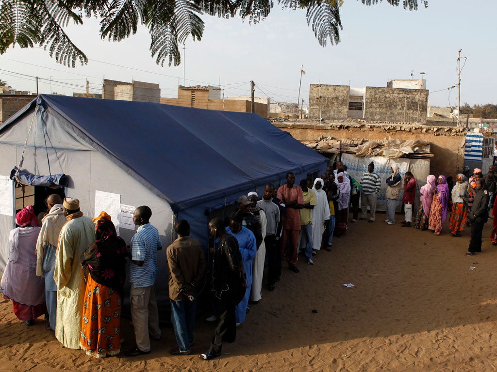 Voters queueing at a polling station in Dakar yesterday