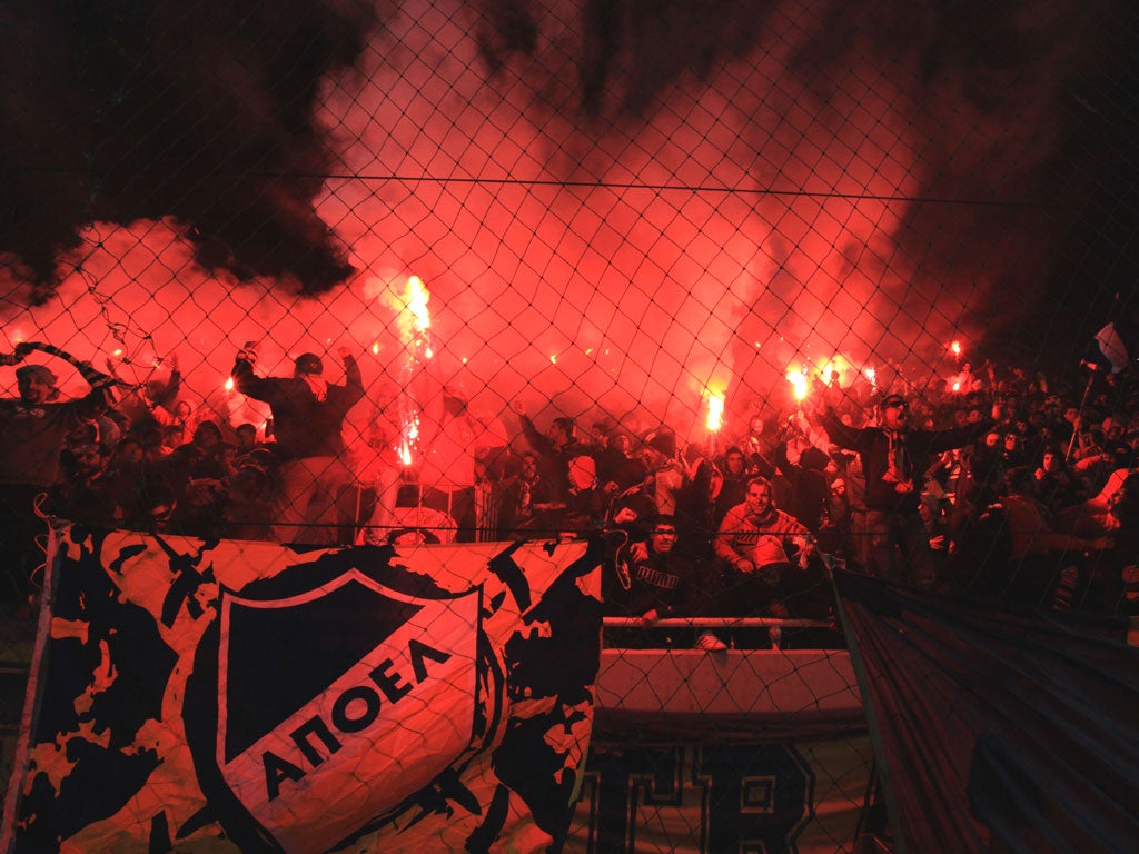 Apoel fans cheer their Champions League win over Lyon