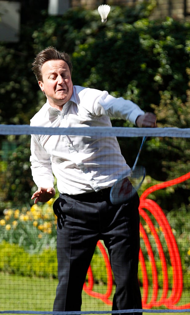 Prime Minister David Cameron plays badminton