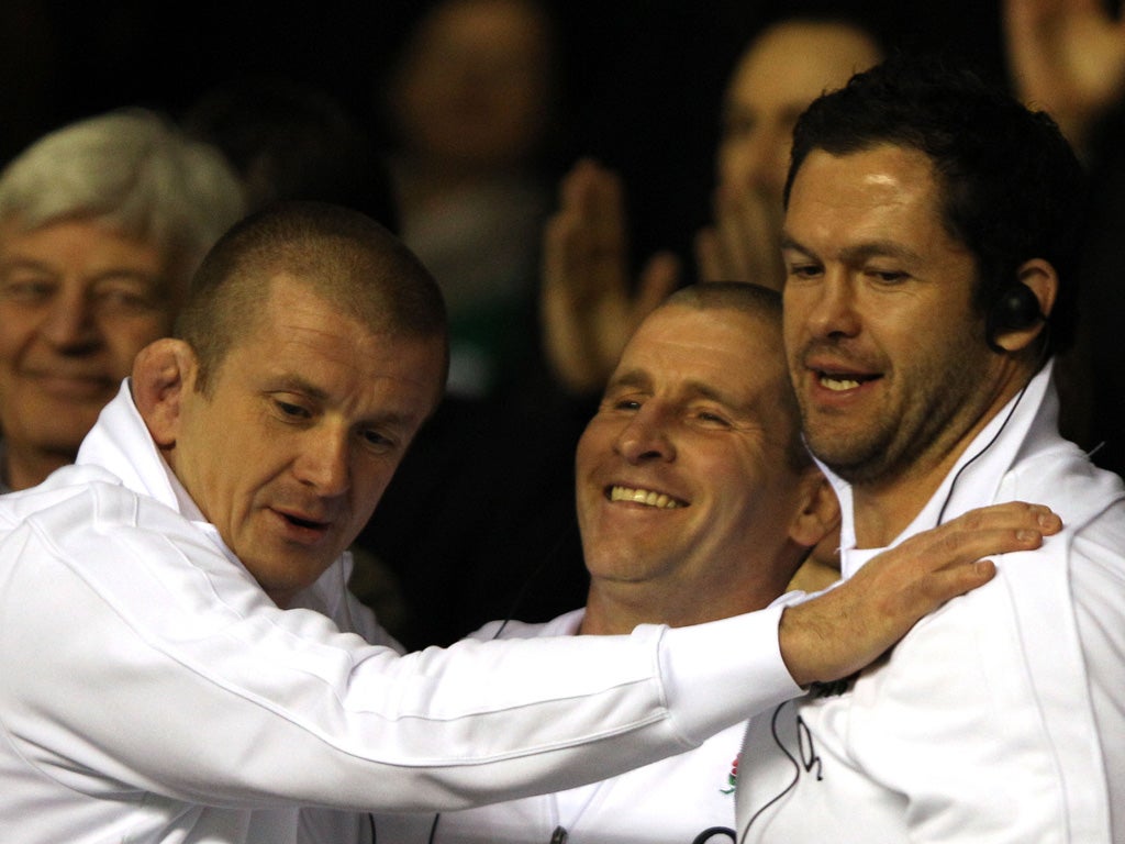 Lancaster (centre) celebrates Six Nations victory over Ireland with Rowntree and Farrell (right)