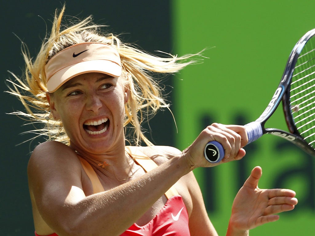 Maria Sharapova plays a forehand during her win over Caroline
Wozniacki