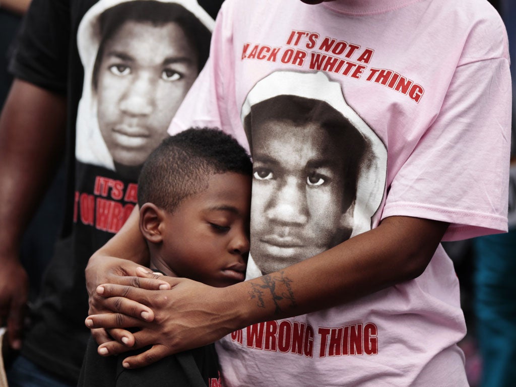 March 31, 2012: LeTasha Brown stands with her arms around Anthony Dixon Jr. during an NAACP march and rally to the front of the Sanford Police Department for Trayvon Martin in Sanford, Florida. Sanford is the Florida town where Trayvon Martin, 17, was sho