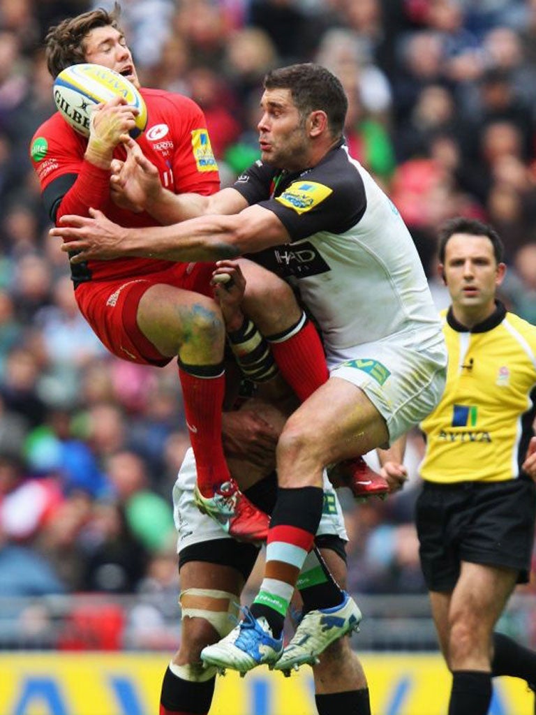 Saracens’ Alex Goode (left) clashes with Nick Easter at Wembley