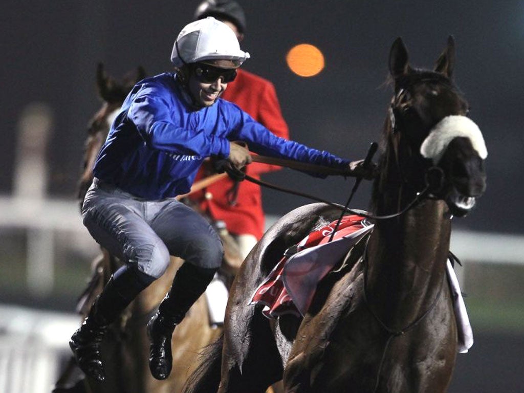 Mickael Barzalona leaps off Monterosso after their Dubai World Cup win