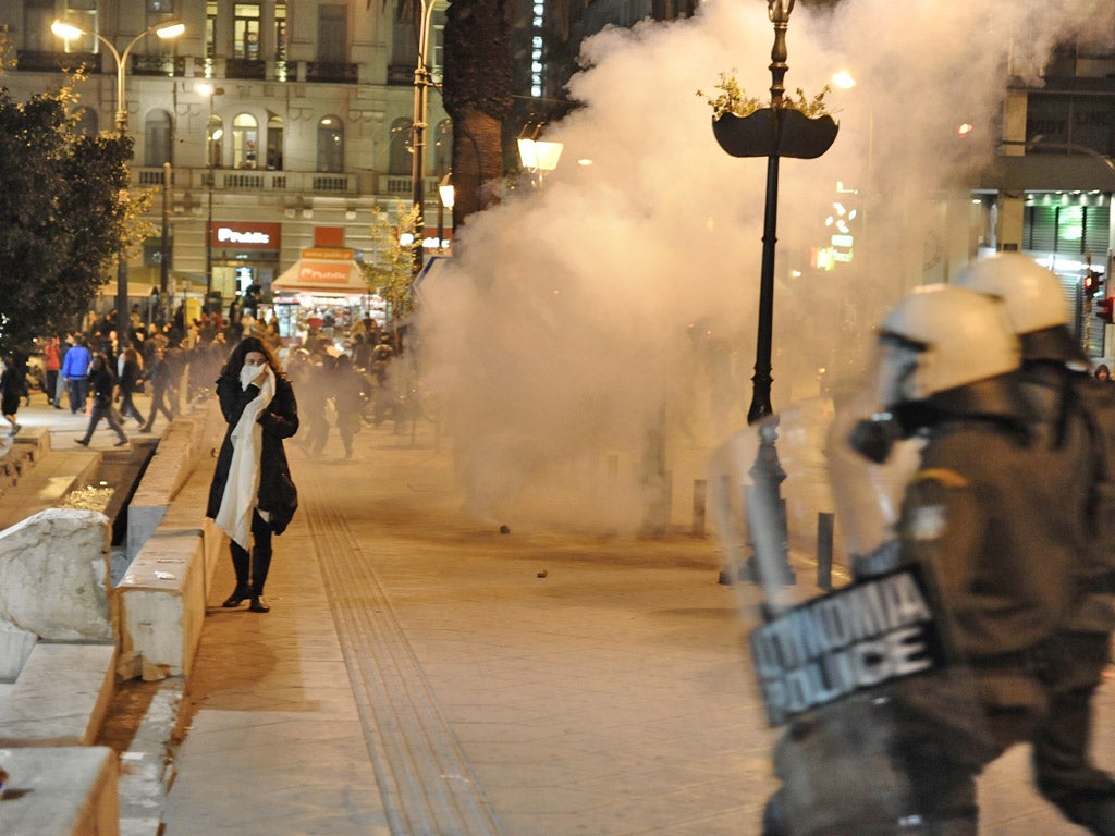 Demonstrators clash with riot police in Athens