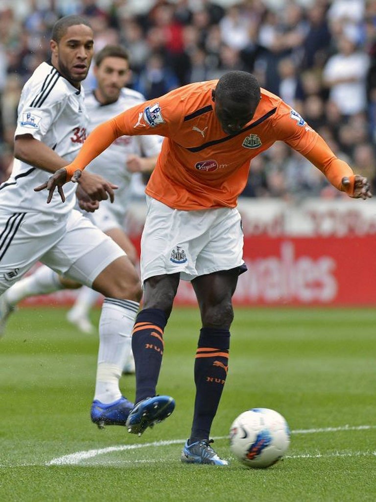 Newcastle's Papiss Cissé scores the first of his two goals yesterday