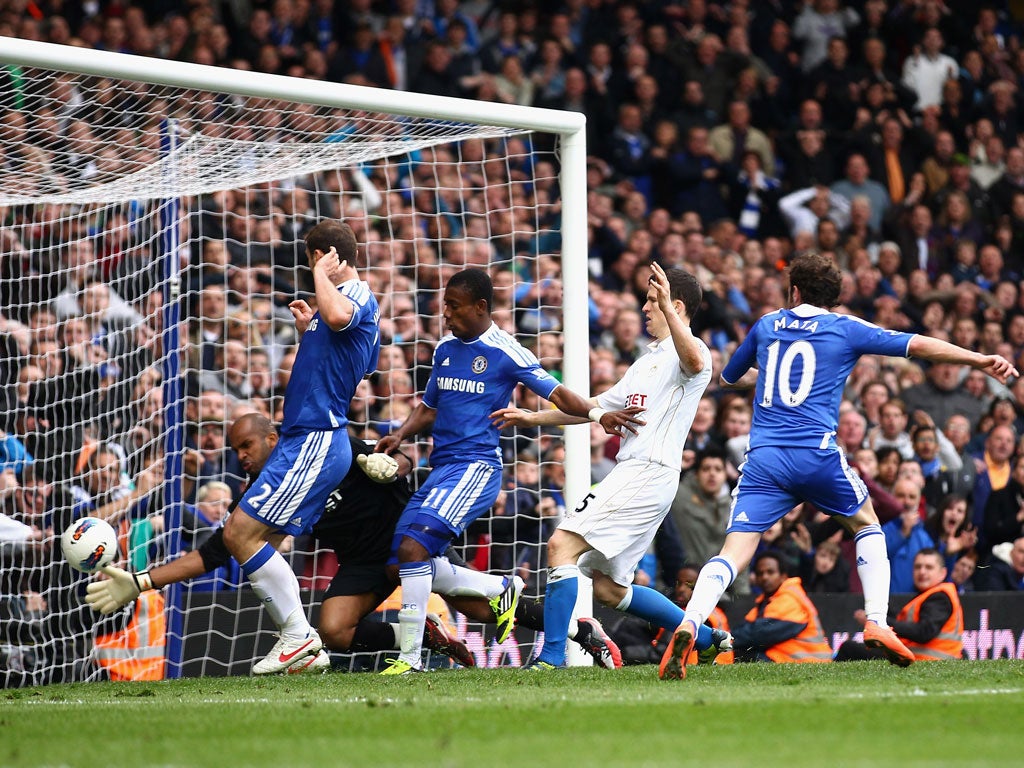 Juan to savour: Chelsea's Juan Mata scores late on to earn his side a 2-1 victory and deny Wigan a priceless point in their battle against relegation