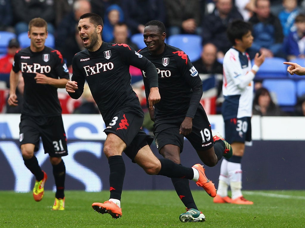 Clint makes his day: Clint Dempsey wheels away after scoring his first