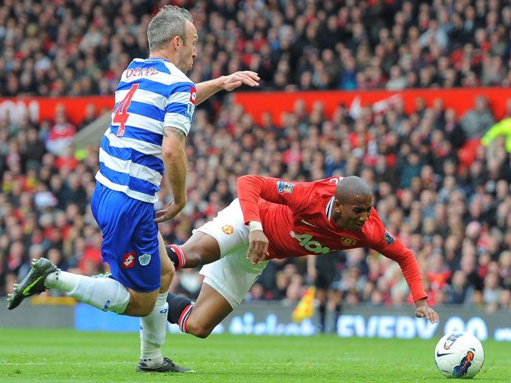 Ashley Young flies through the air to win a penalty after Shaun Derry’s minimal contact