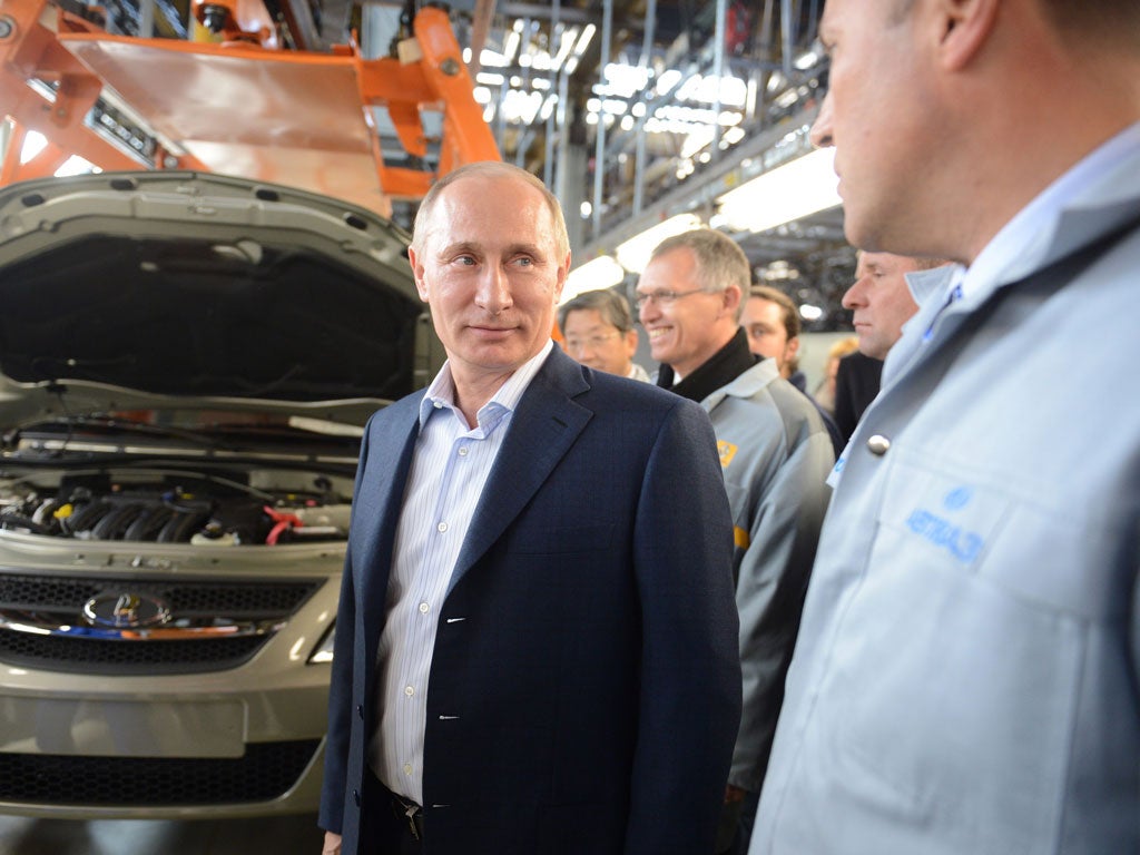 Vladimir Putin on a Lada assembly line