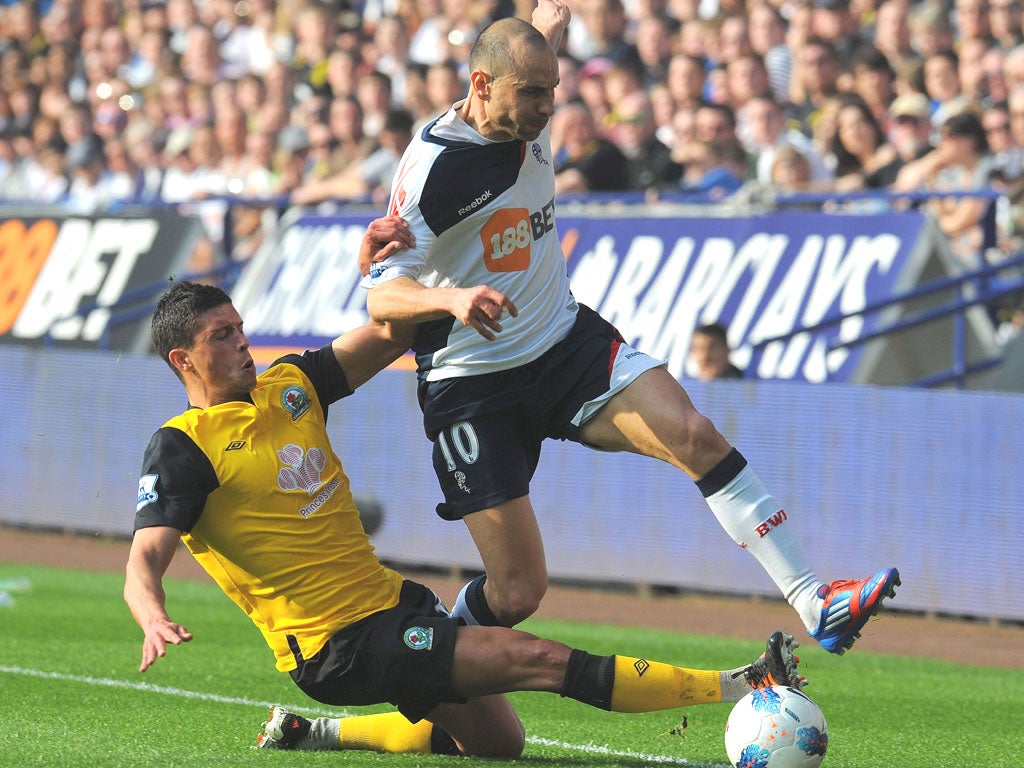 Jason Lowe challenges Bolton’s Martin Petrov in last month’s derby