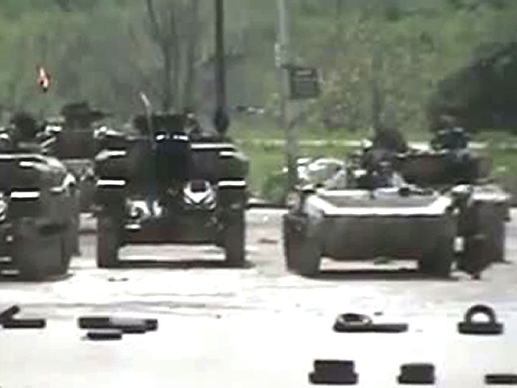 Army tanks in Homs, where 52 were reported killed yesterday