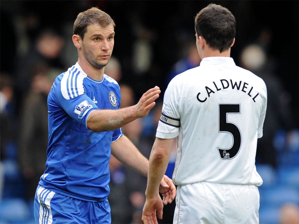 Branislav Ivanovic with Wigan's Gary Caldwell after the game