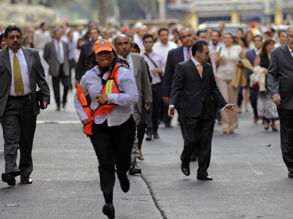 People return to their offices after an earthquake in Mexico City