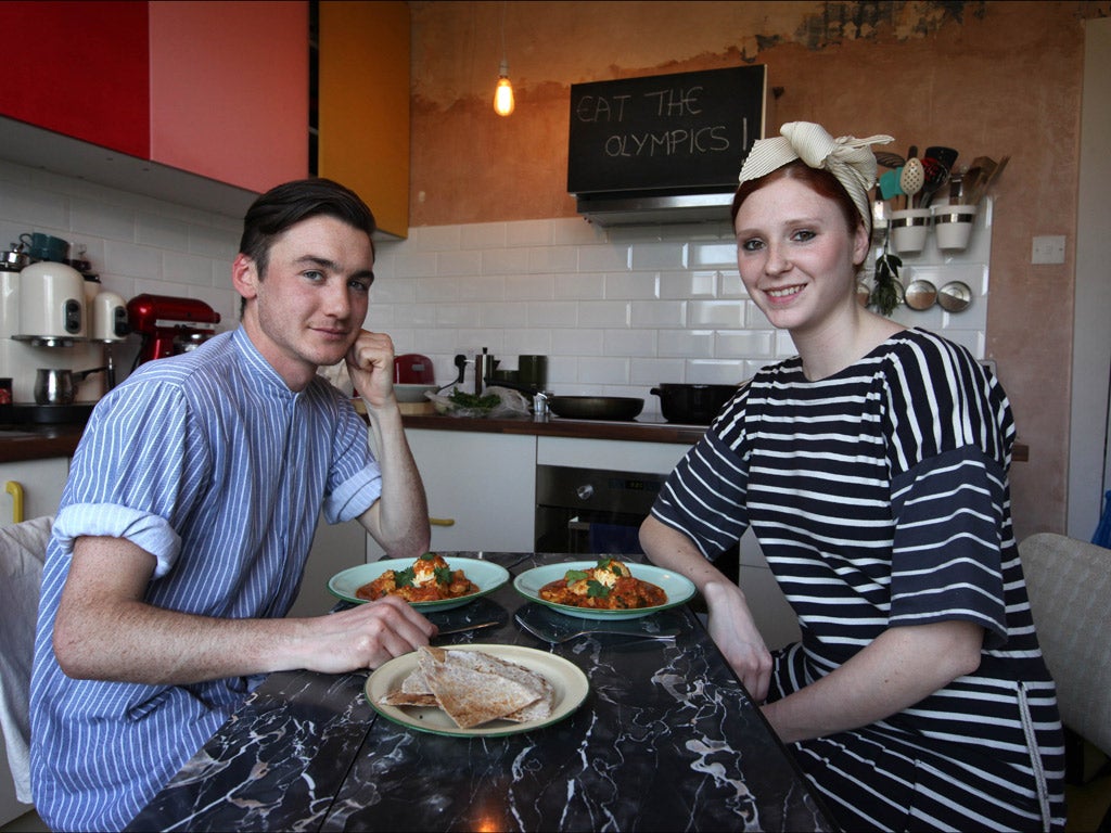 Jack Hemingway and Sarah Kemp tuck into a Kenyan Kuku Paka - one of their 205 'Eat the Olympics' dishes