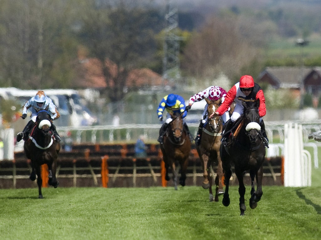 Ruby Walsh eases Big Buck's (far right) to a record 17th win at Aintree yesterday