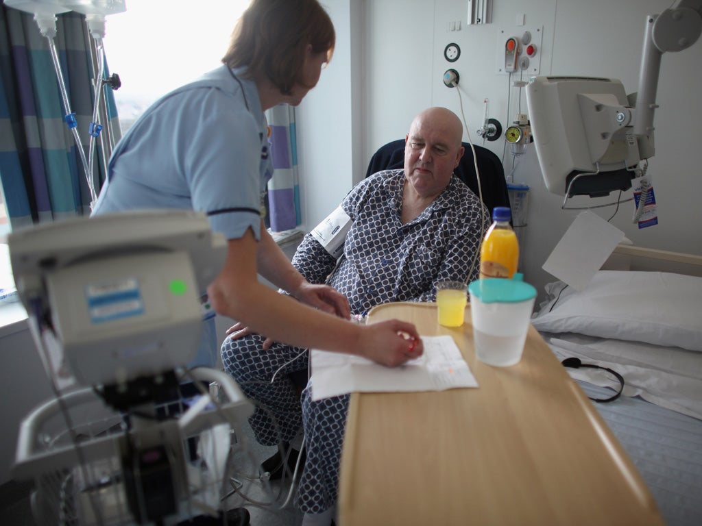 A nurse tends to a patient