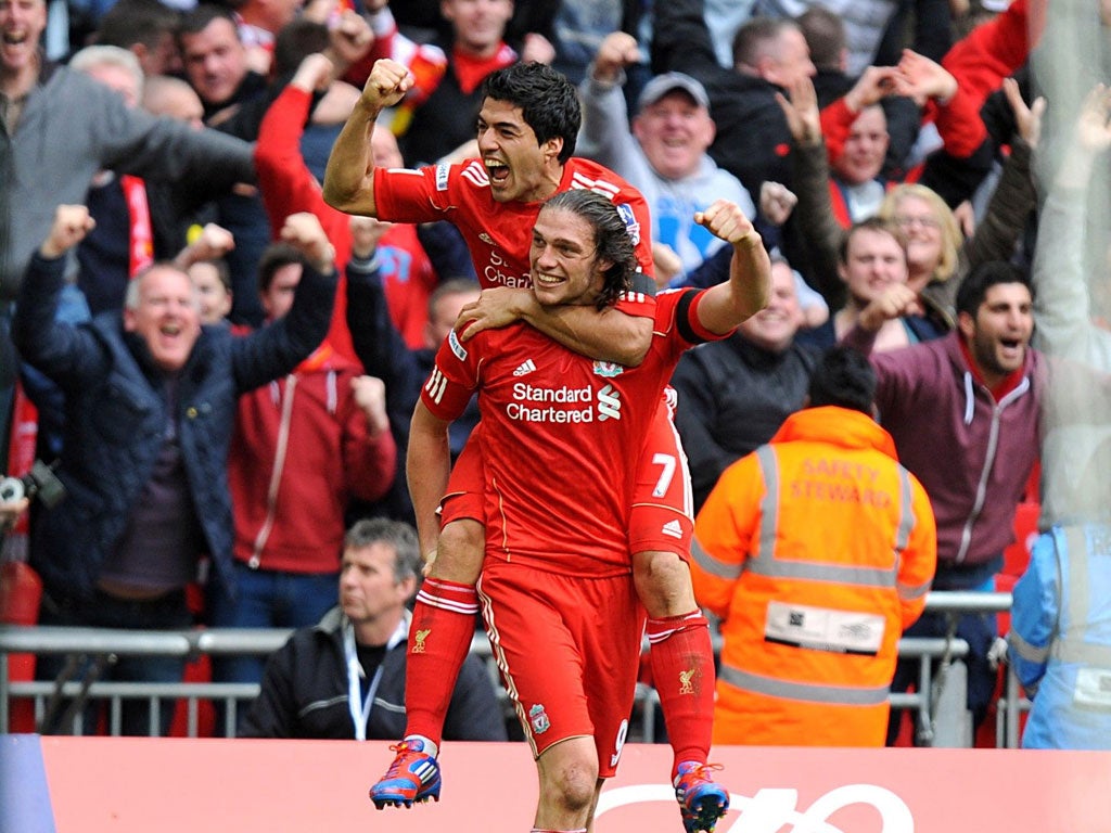 Andy Carroll celebrates with Luis Suarez