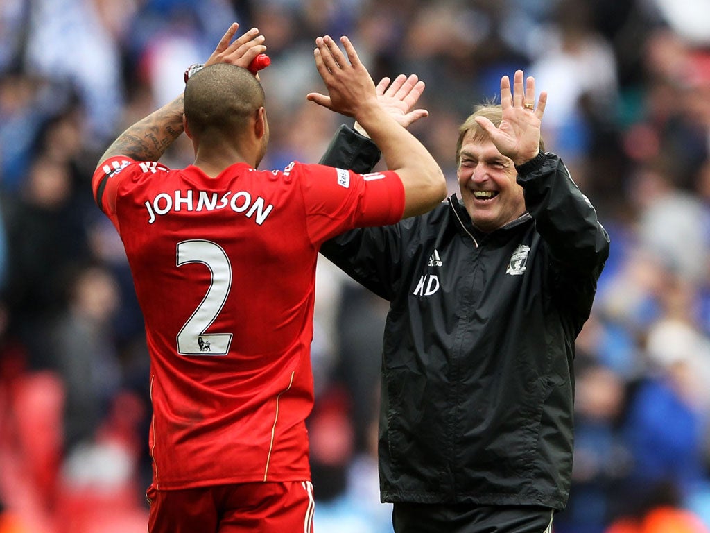 Grin and bear it: Kenny Dalglish (right) celebrates with Glenn Johnson