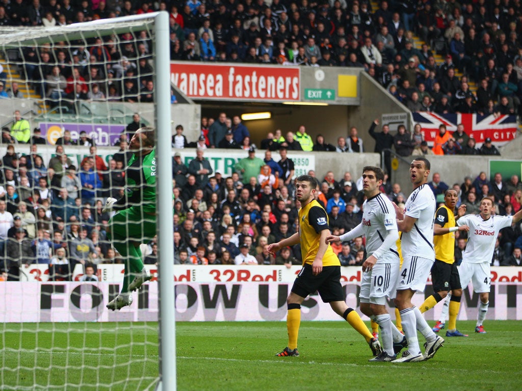 In the bag: Gylfi Sigurdsson (far right) scores the opener in Swansea's easy win