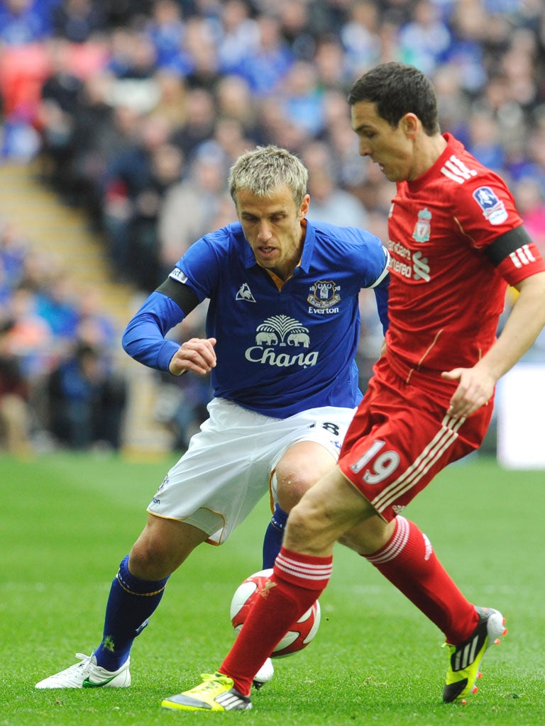 Everton’s Phil Neville closes down Stewart Downing on Saturday