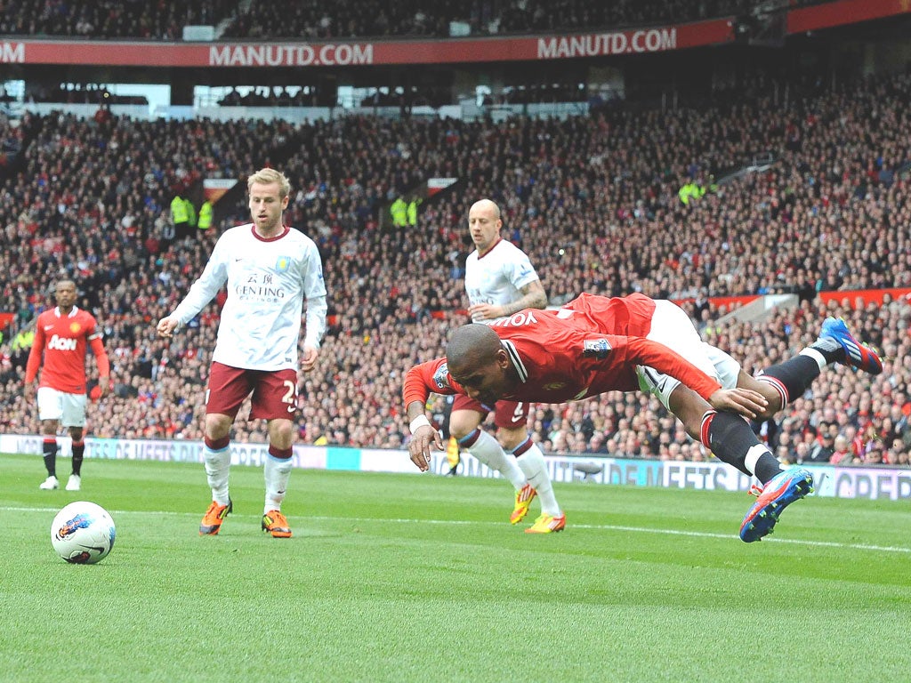 Ashley Young takes a tumble