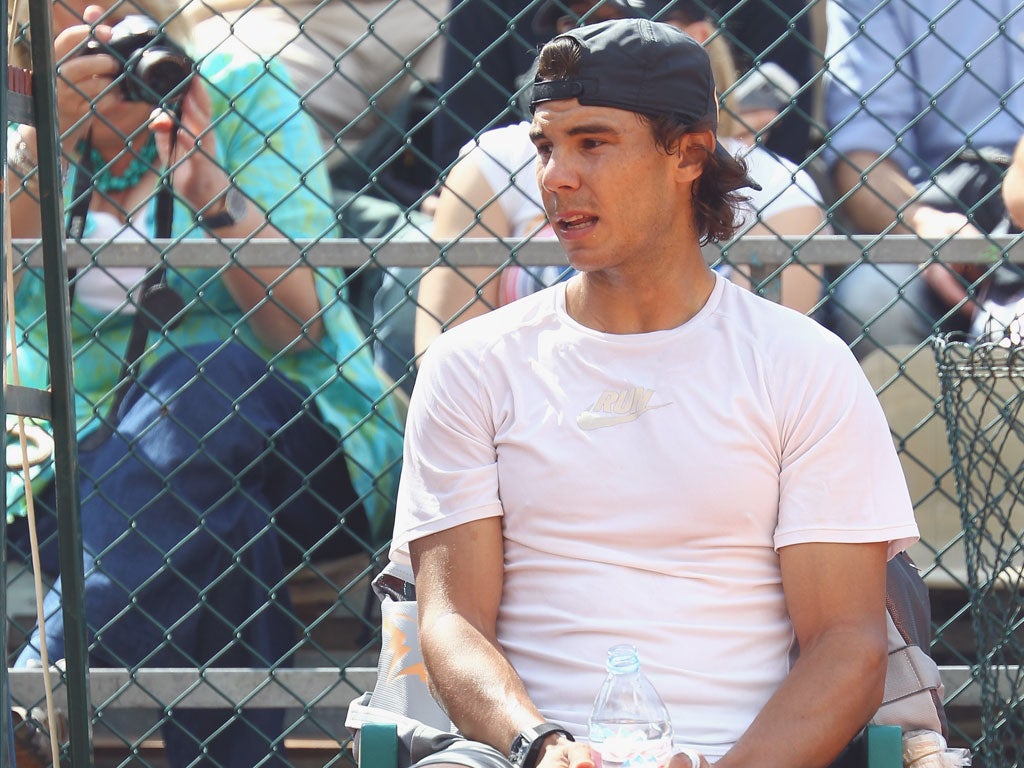 Rafael Nadal takes a break during practice in Monte Carlo