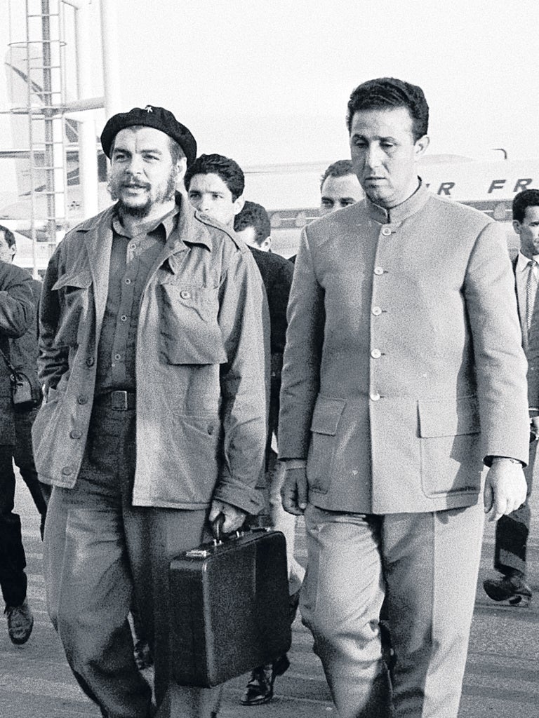 Comrades: Ben Bella, right, with Che Guevara at Algiers airport in 1964