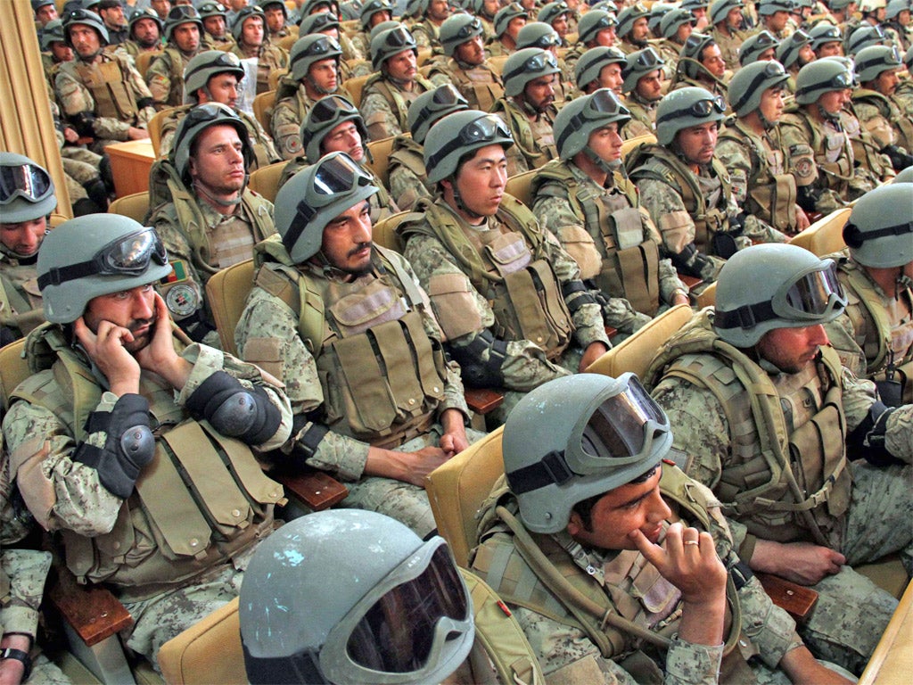 Afghan police at a ceremony yesterday to honour those who defended Kabul from a Taliban attack