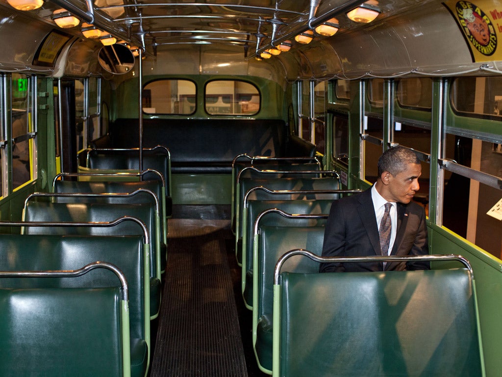 President Obama sits on the bus at the Henry Ford Museum in Detroit made famous by Rosa Parks