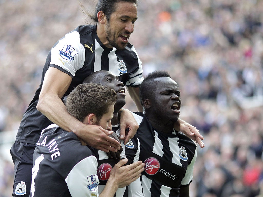 Cheick Tiote celebrating with his Newcastle team-mates