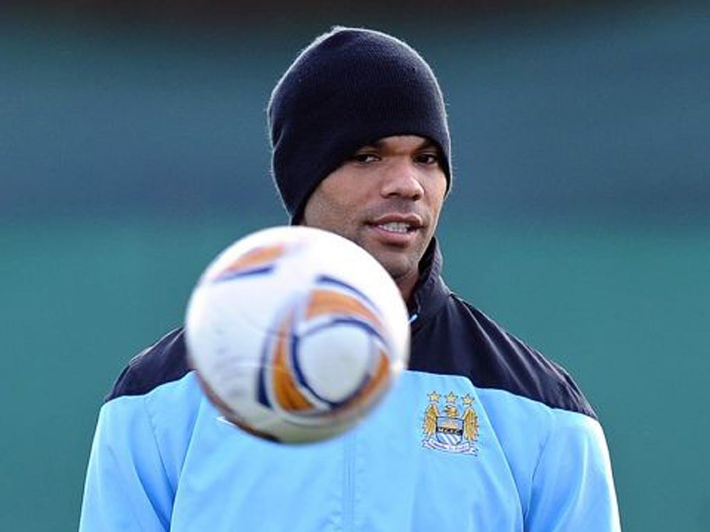 Joleon Lescott takes it easy during City training