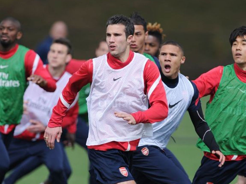 Robin van Persie trains at London Colney yesterday