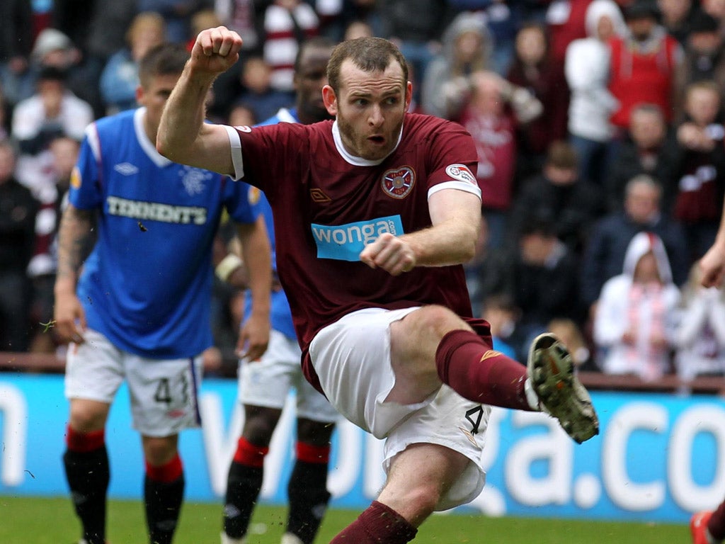 Penalty paid: Craig Beattie misses from
the spot as Hearts lose to Rangers